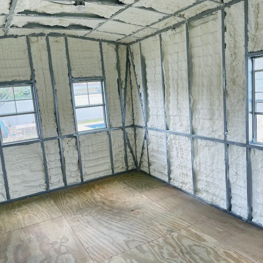 Closed-cell spray foam insulation applied to wall cavities in a residential project in Devils Lake